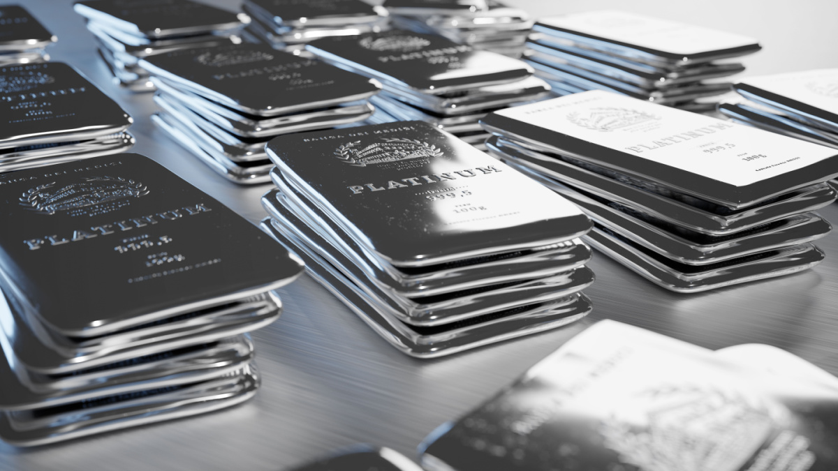 Multiple imperfect piles of 100g medici platinum bullions. The bars are polished, with a flat surface. Embossing