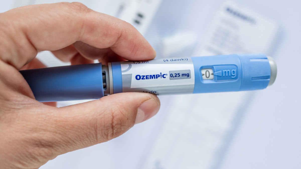 obese fat man preparing Semaglutide Ozempic injection control blood sugar levels