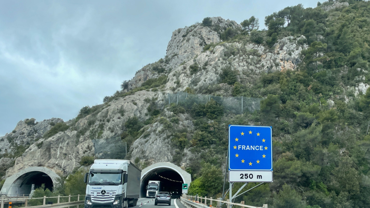 Country border sign at Italian French border crossing at Cote d'Azur, Ventimiglia, Italy