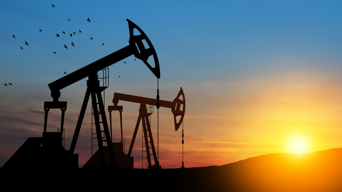 The change in oil prices caused by the war. Oil price cap concept. Oil drilling derricks at desert oilfield. Crude oil production from the ground. Petroleum production.