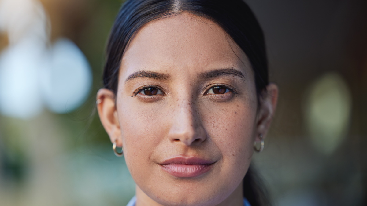 Woman, serious and portrait in a closeup with thinking in the outdoor with an idea in mexico. Face, female person and beauty with focus and calm with vision, eye and skin with concentration for goal.