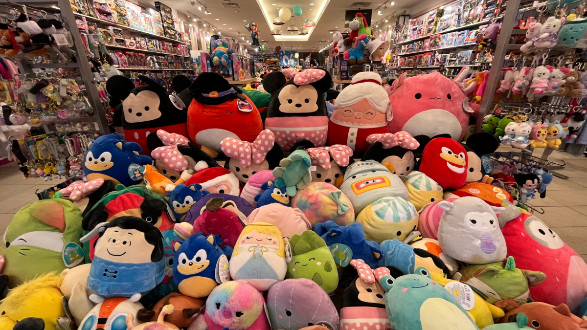 Piles of different Squishmallow toys that are for sale.