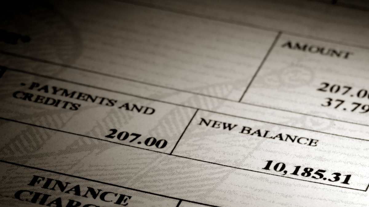 High credit card dollar amount of an outstanding debit balance on a bank revolving charge account monthly financial statement showing significant finance debt and insufficient payment