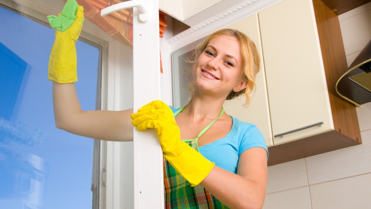 Women cleaning a window 3.