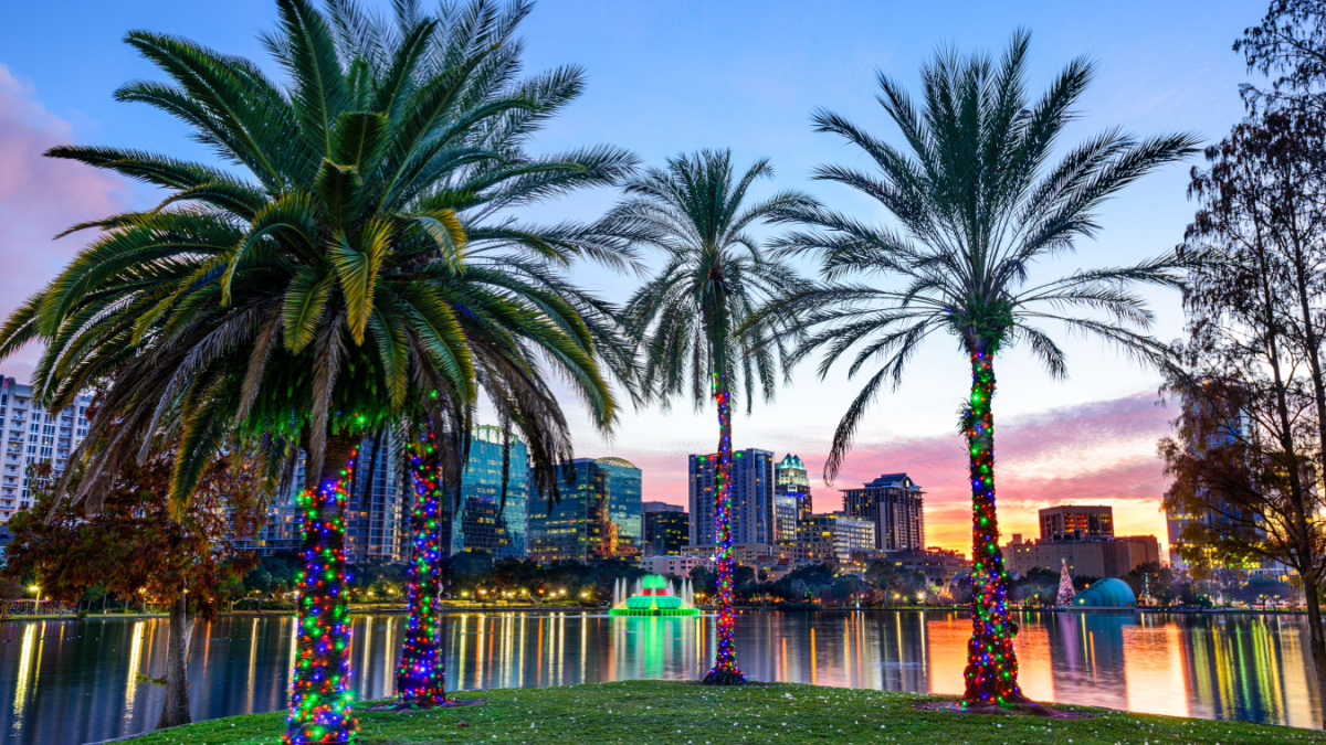 Orlando, Florida, USA downtown skyline at Eola Lake.