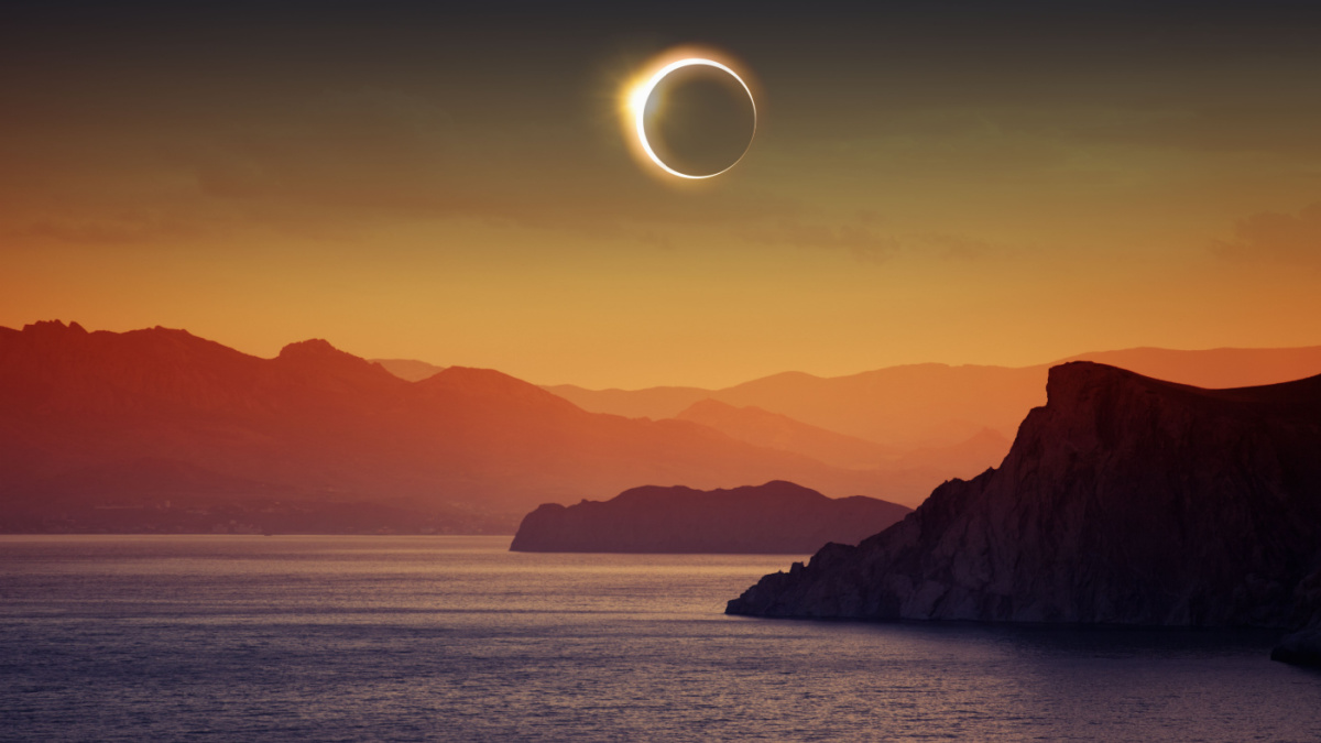 Scientific background, astronomical phenomenon - full total solar eclipse, mountains and sea