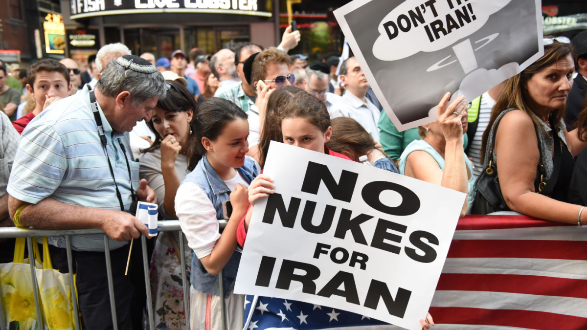 thousands rallied in Times Square to oppose the President's proposed nuclear deal with Iran. Rally attendees with anti-Iran signs