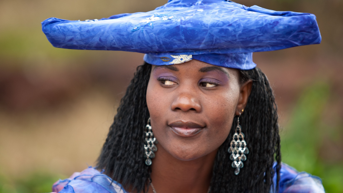 african girl with traditional clothing, hairstyle and jewelry, Namibia, South Africa, and Botswana.