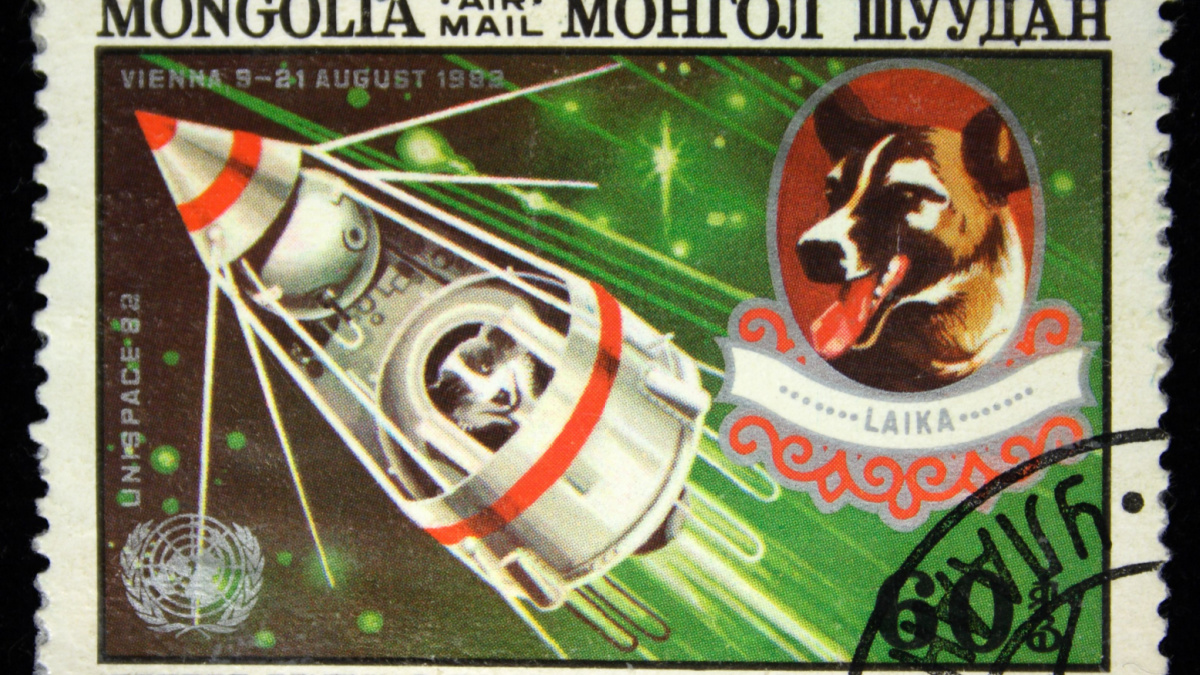 A stamp printed in Mongolia shows Laika - first dog in space, circa 1982