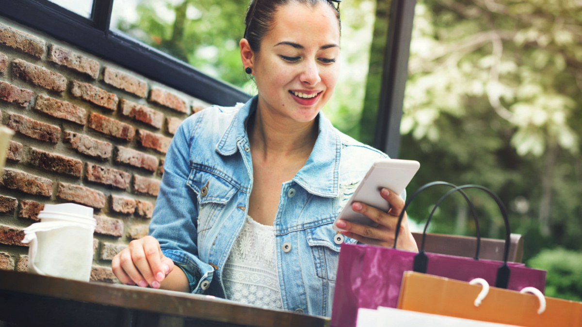 Woman Shopping Outdoor Mobile Phone Concept.