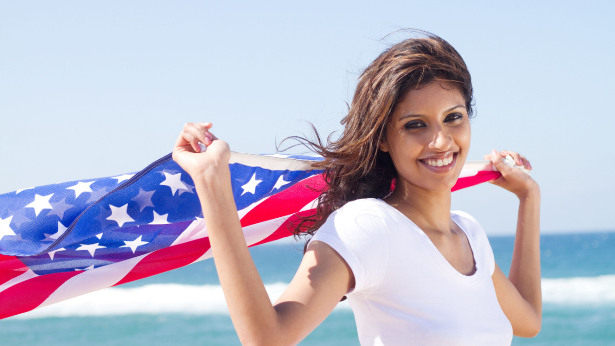 beautiful young woman with american flag.