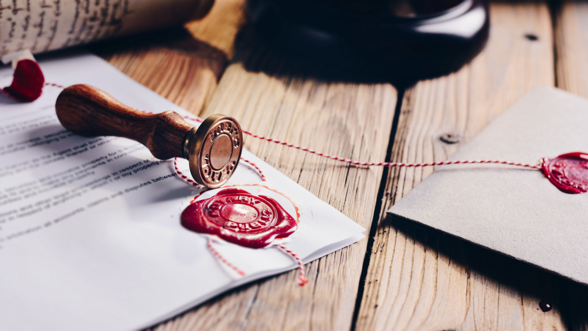 Notary public wax stamper and wax seal on document