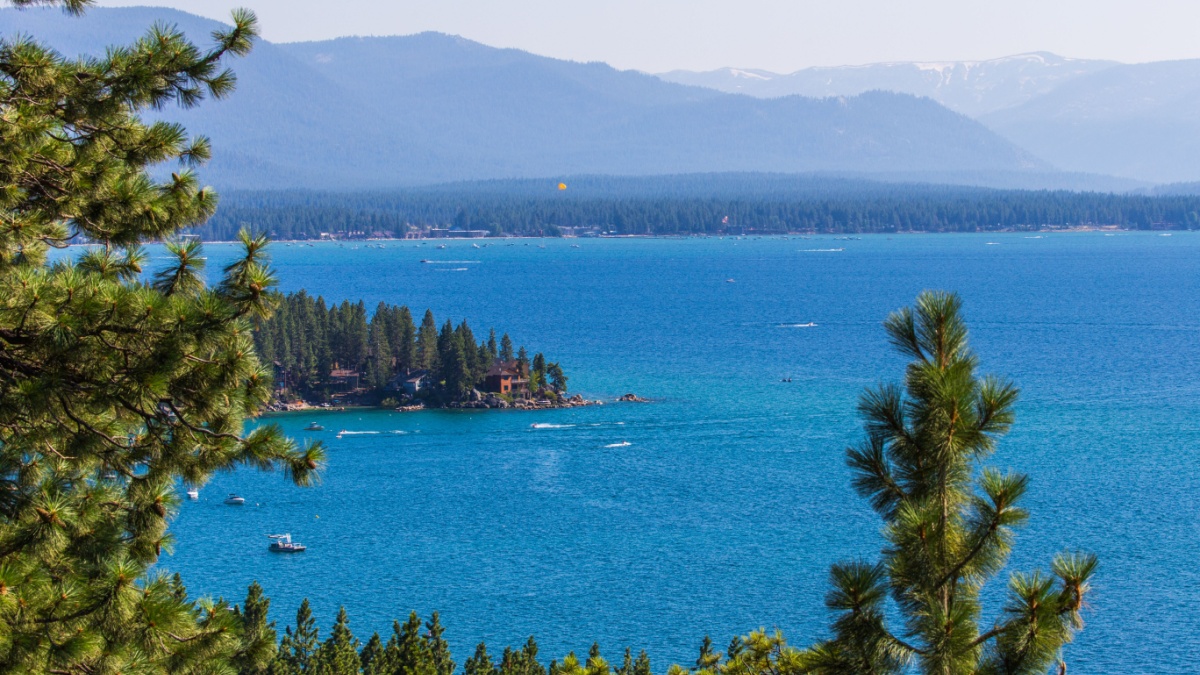 View of Lake Tahoe through pine trees in Zephyr Cove, Nevada.