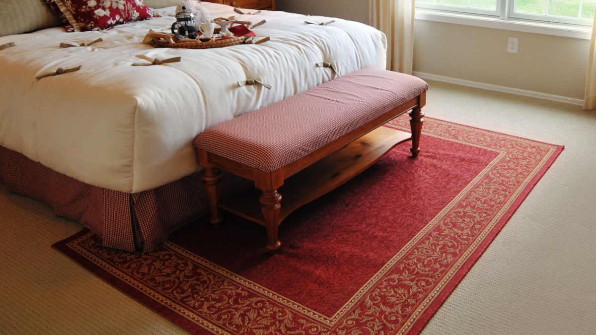 Traditional woven rug in beautiful bedroom