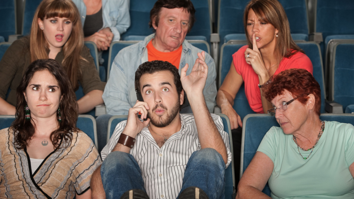 Loud bearded man on phone annoys the audience in theater
