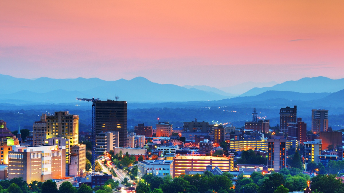 Asheville, North Carolina skyline nestled in the Blue Ridge Mountains.