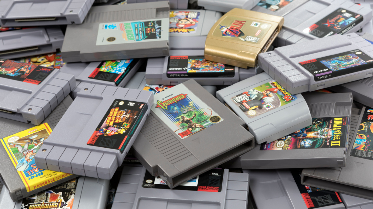 A studio shot of a large pile of Nintendo cartridges.