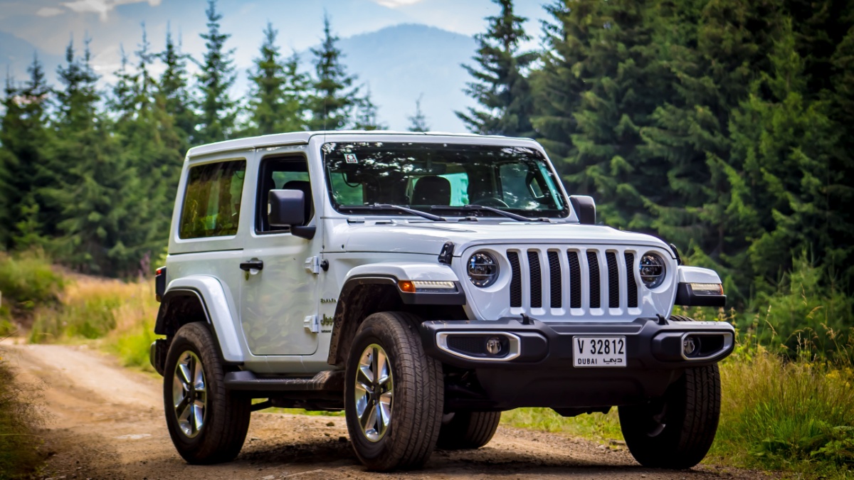 Spielberg / Austria - 07/17/2018: The 2019 Jeep Wrangler JL Sahara off-road with mountains in the background.