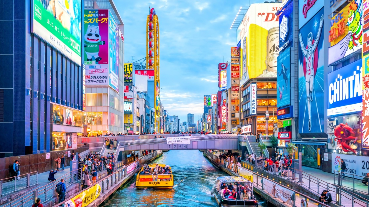 Tourists at Dotonbori shopping street, Dotonbori is the famous destination for traveling and shopping in Osaka, Japan.