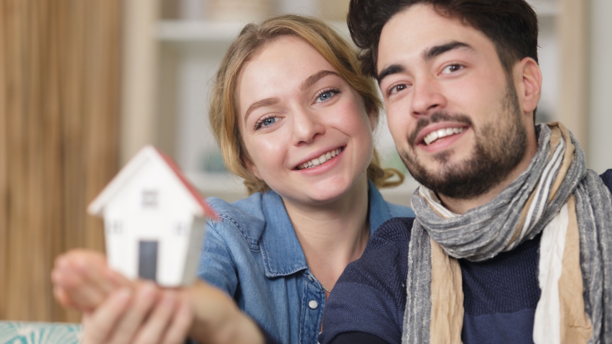 couple showing affection with home symbol.