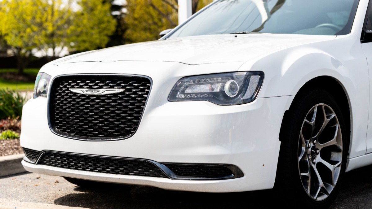 JOLIET, IL, USA - APRIL 28, 2019: The front end of a white 2018 Chrysler 300 with a beautiful bokeh / blurred background.