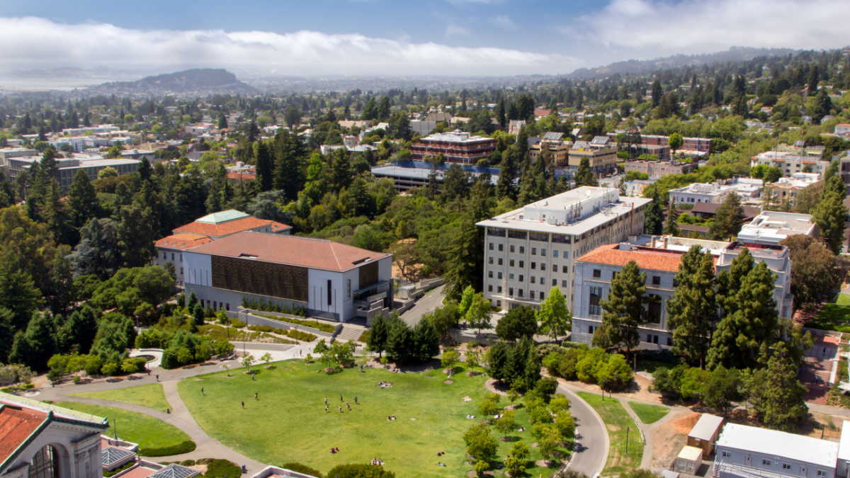 Overhead view of historic University of California at Berkeley with the San Francisco Bay skyline in background.