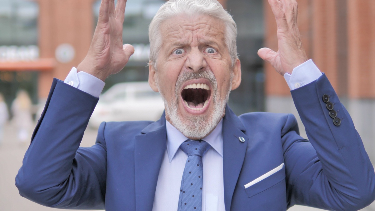 Outdoor Portrait of Screaming Old Businessman, Shouting.