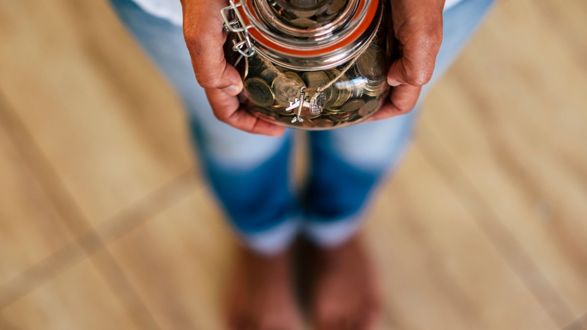 Above view with defocus .Concept of money saving in a glass transparent piggy bank.