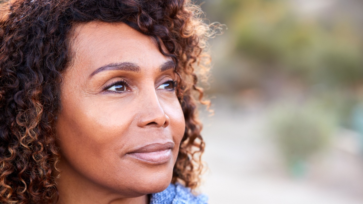 7 Ways To Improve Your Finances With a Social Media Detox 7 Outdoor Portrait Of Serious African American Senior Woman With Mental Health Concerns.