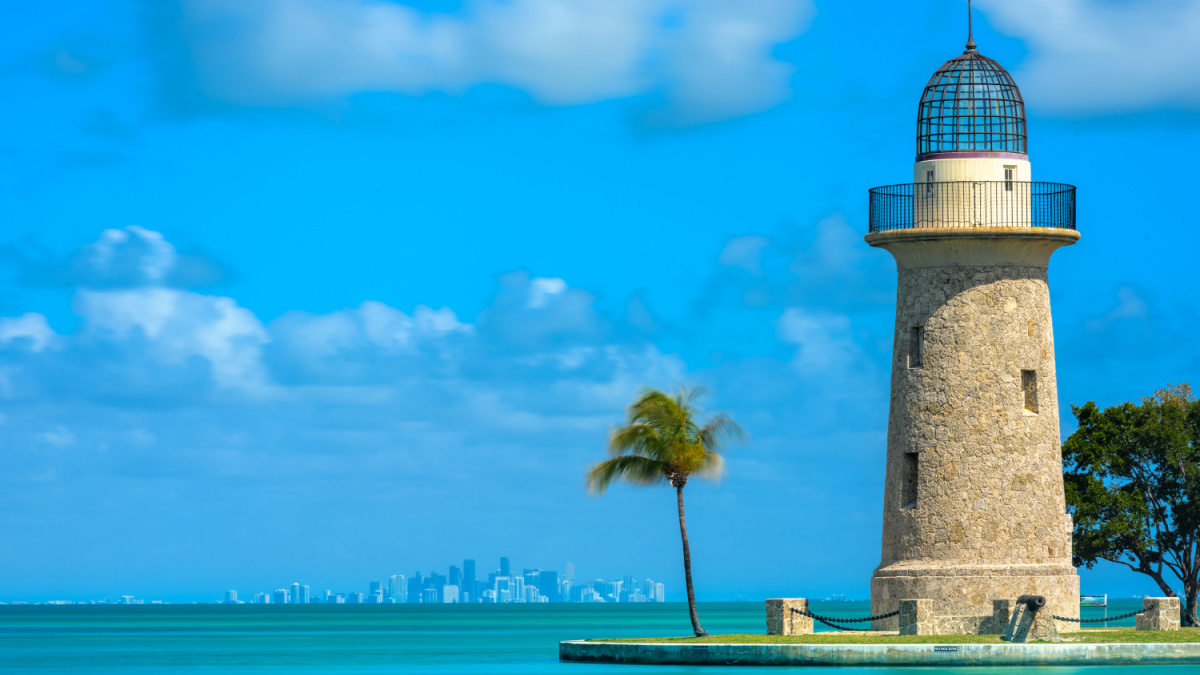 Boca Chita Lighthouse and Miami Skyline on calm day, Biscayne National Park