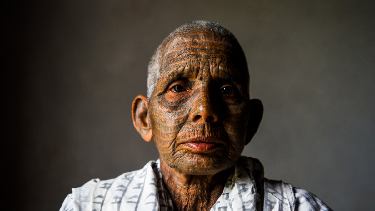 A member of the Ramnami sect follower tattoo the word