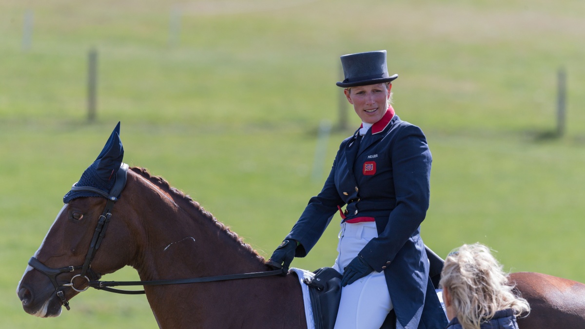 A smiling Zara Tindall riding her horse Class Affair taking part in the Dressage phase of the CCI4*-L Competition