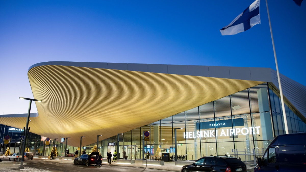 The new Terminal 2 extension of Helsinki Vantaa Airport, modern Finnish architecture, contemporary Scandinavian building design style at night
