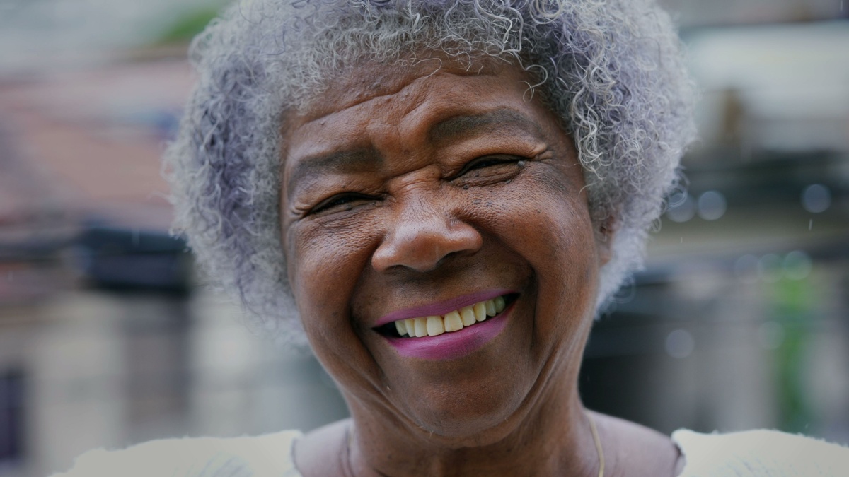 A Happy senior Brazilian woman portrait face closeup smiling.