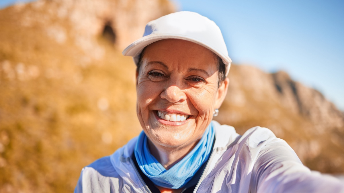 Im happiest when Im out in nature. Shot of a mature woman taking a selfie in nature.