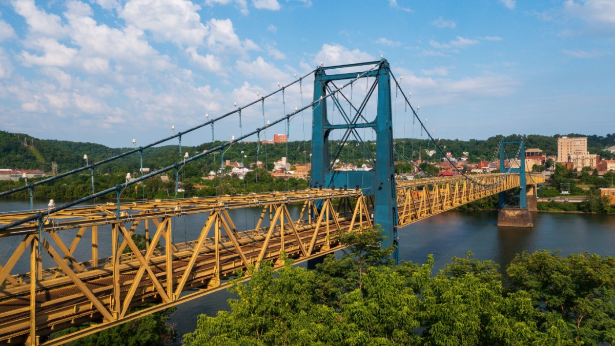 This is an afternoon view of the historic Market Street Bridge, a wire suspension and Warren through truss over the Ohio River between Weirton, West Virginia and Steubenville, Ohio.