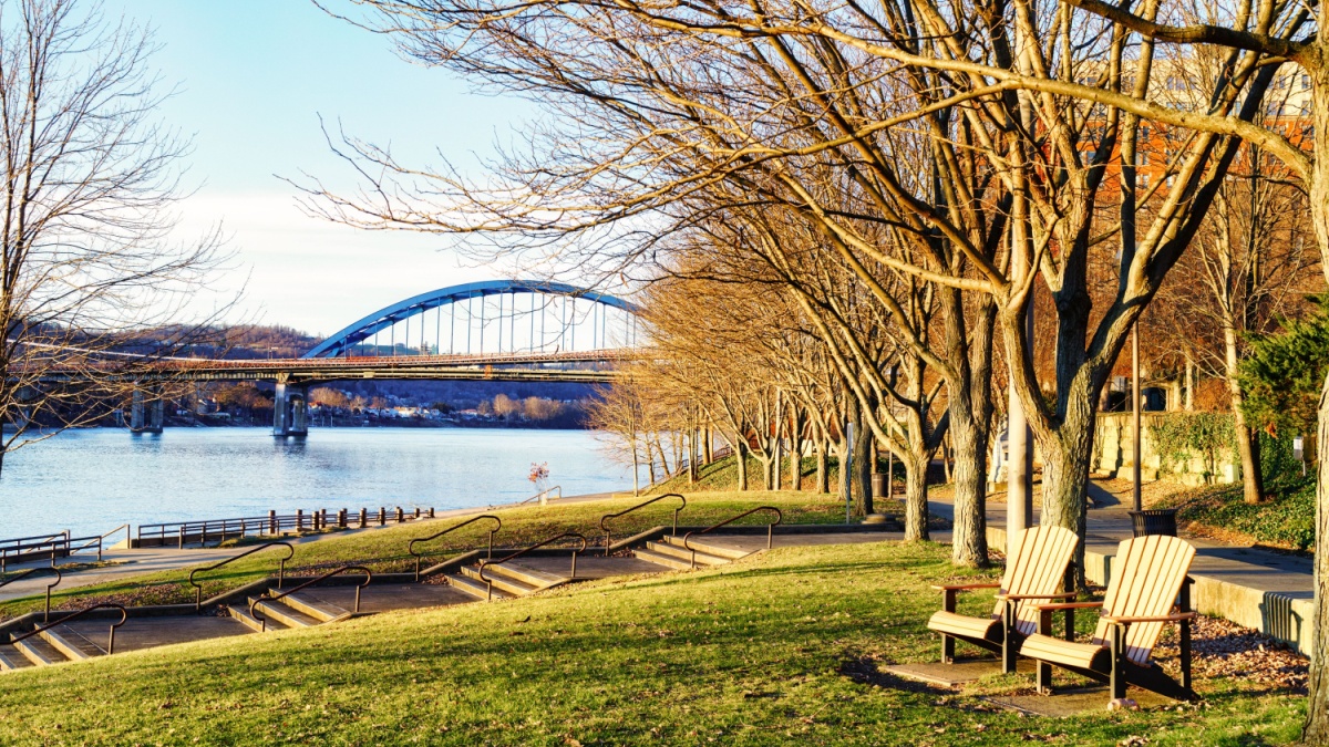 View of the Ohio River with Wheeling Suspension and Fort Henry bridges between Ohio and W. Virginia, from Heritage Port waterfront park, Wheeling, West Virginia.