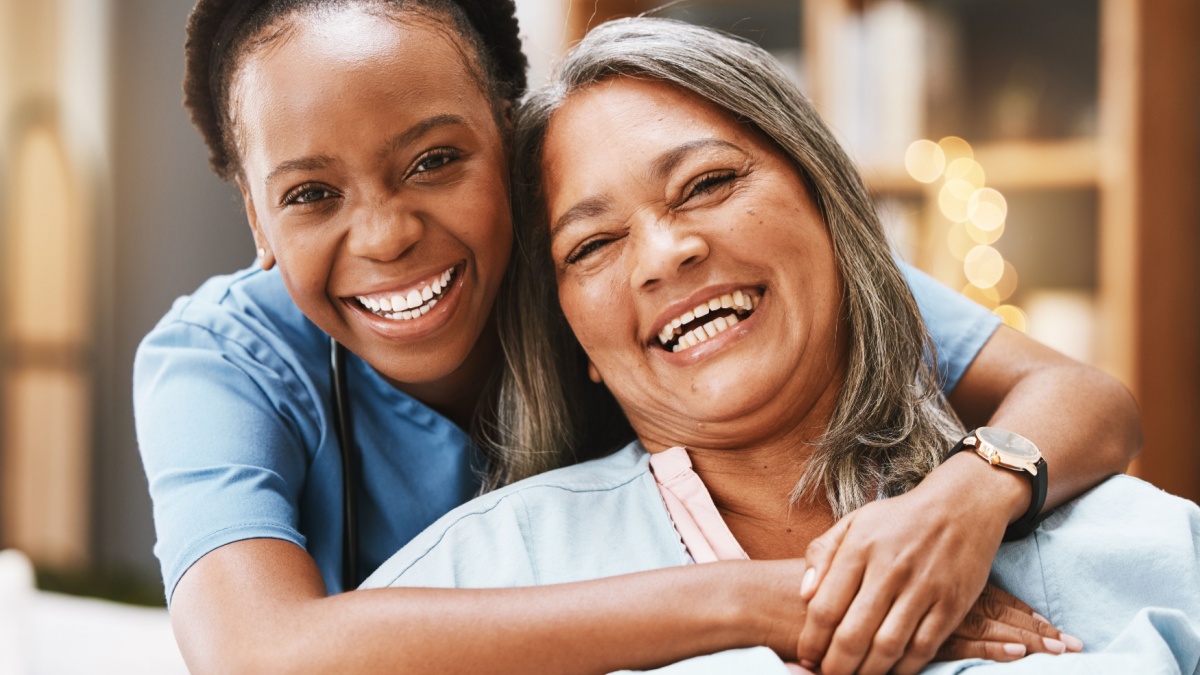 Senior care, hug and portrait of nurse with patient for medical help, healthcare or physiotherapy.
