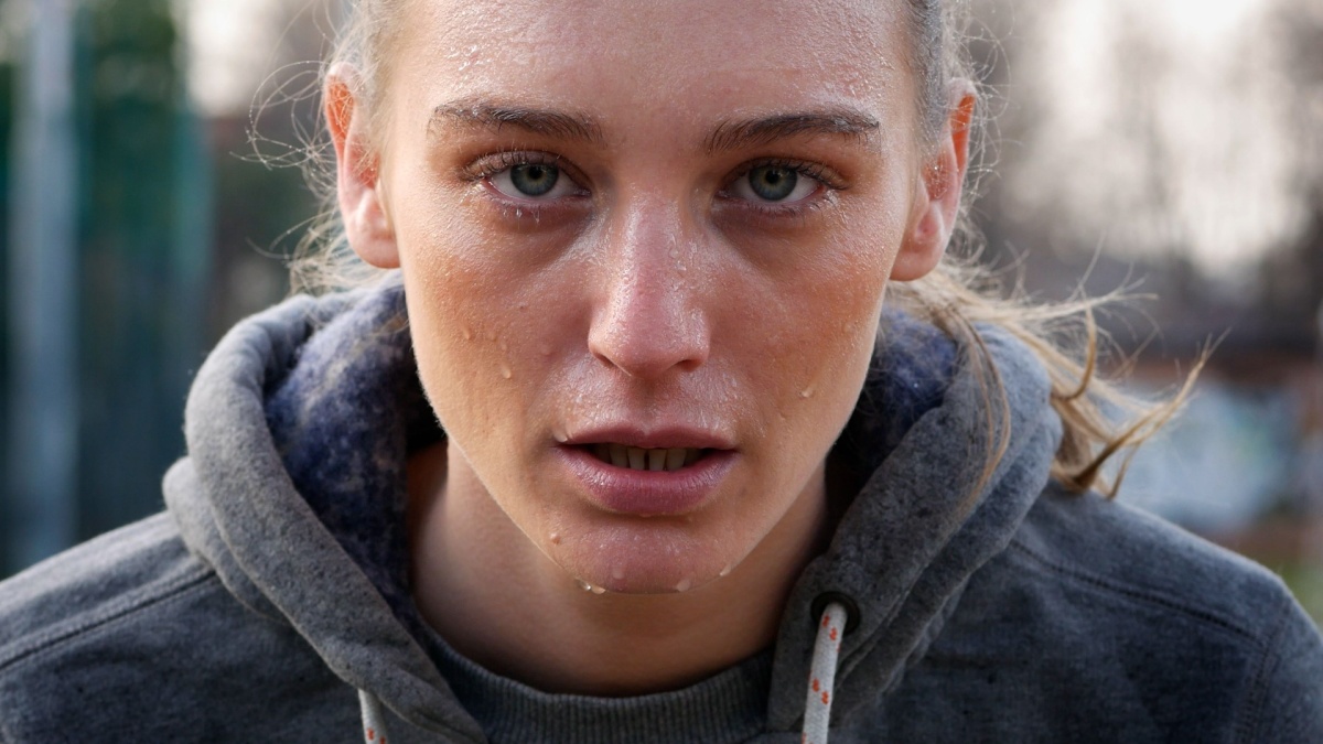 Sweaty Self-confident Woman Training Outdoors.