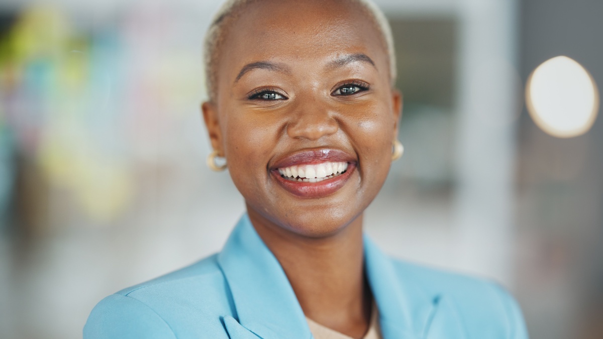 Agency, face portrait and happy black woman, business or worker confident for startup company mission.