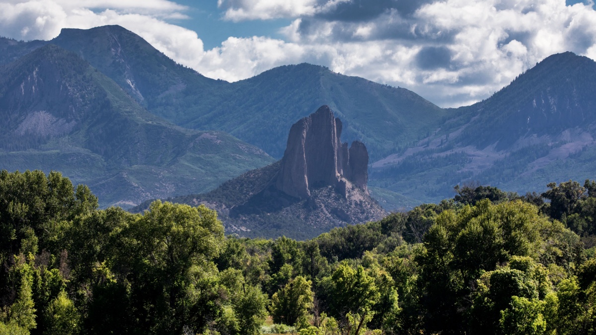 Needle Rock stands out amongst the mountains at Crawford, Colorado