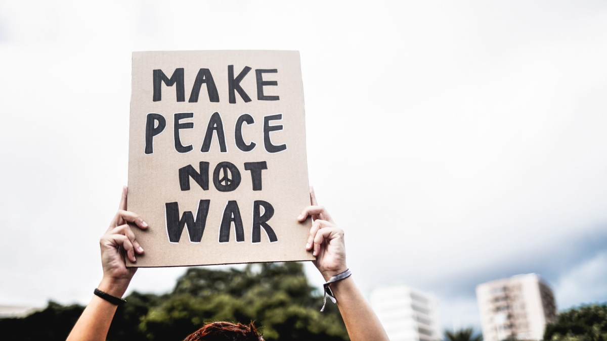 People protest against Israel and Palestine war in the city - Demonstrators fighting for freedom and peace holding banners outdoor