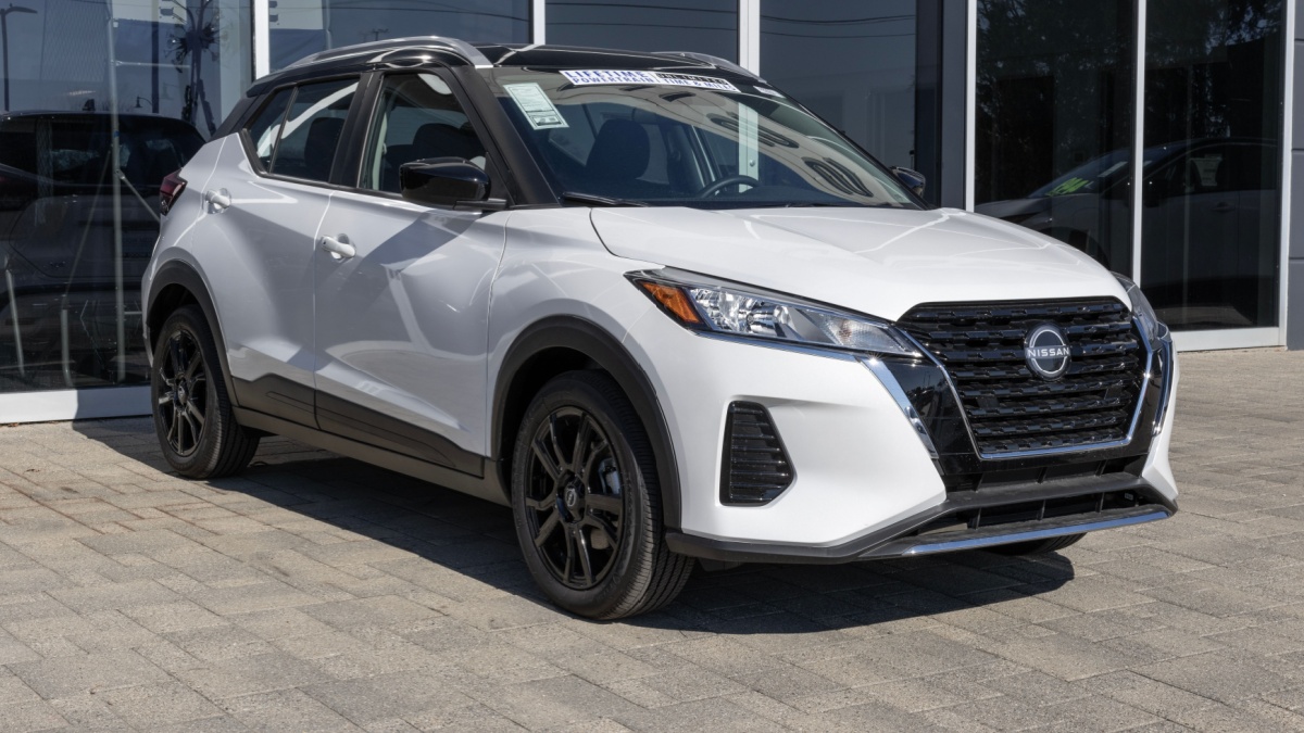 Nissan Kicks Crossover SUV display at a dealership. Nissan offers the Kicks in S, SV, and SR models.