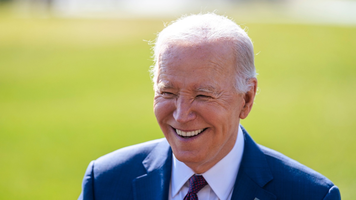 WASHINGTON, DC, USA - February 20, 2024: U.S. President Joe Biden smiles at reporters before departing on Marine One.
