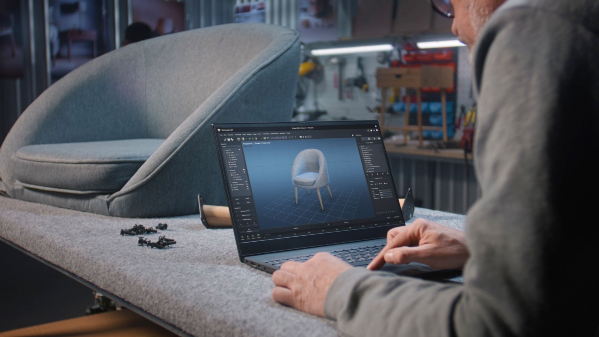 Creative designer creates digital 3D model of stylish wooden chair using laptop computer. Man works in professional ai software for furniture design creation and 3D modeling.