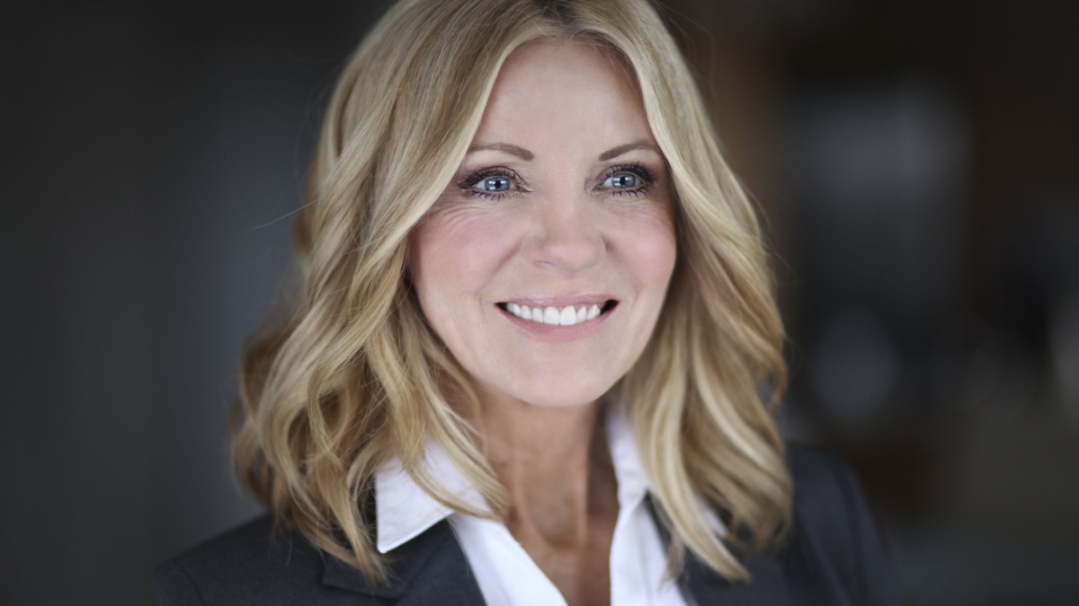 Portrait Of A Mature Businesswoman Smiling Looking away.