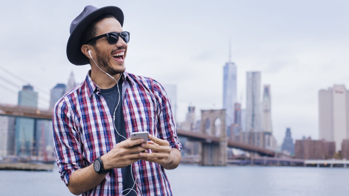Man listening music with his smartphone in Brooklyn, New York
