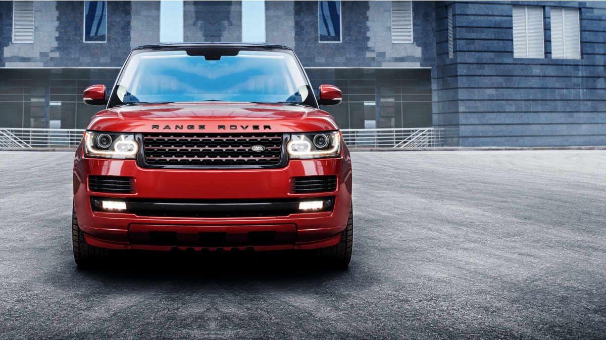 Moscow, Russia - November 22, 2015: Premium car Land Rover Range Rover standing near modern building in the city at daytime.