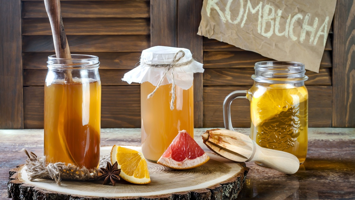 Homemade fermented raw kombucha tea with different flavorings. Healthy natural probiotic flavored drink.