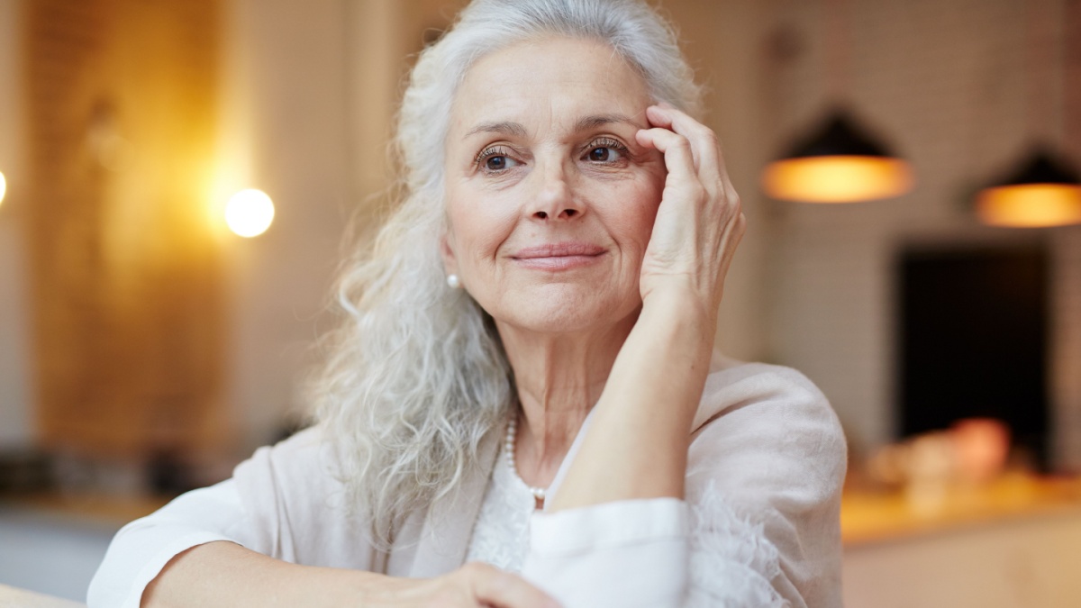 Serene woman relaxing in cafe at leisure.